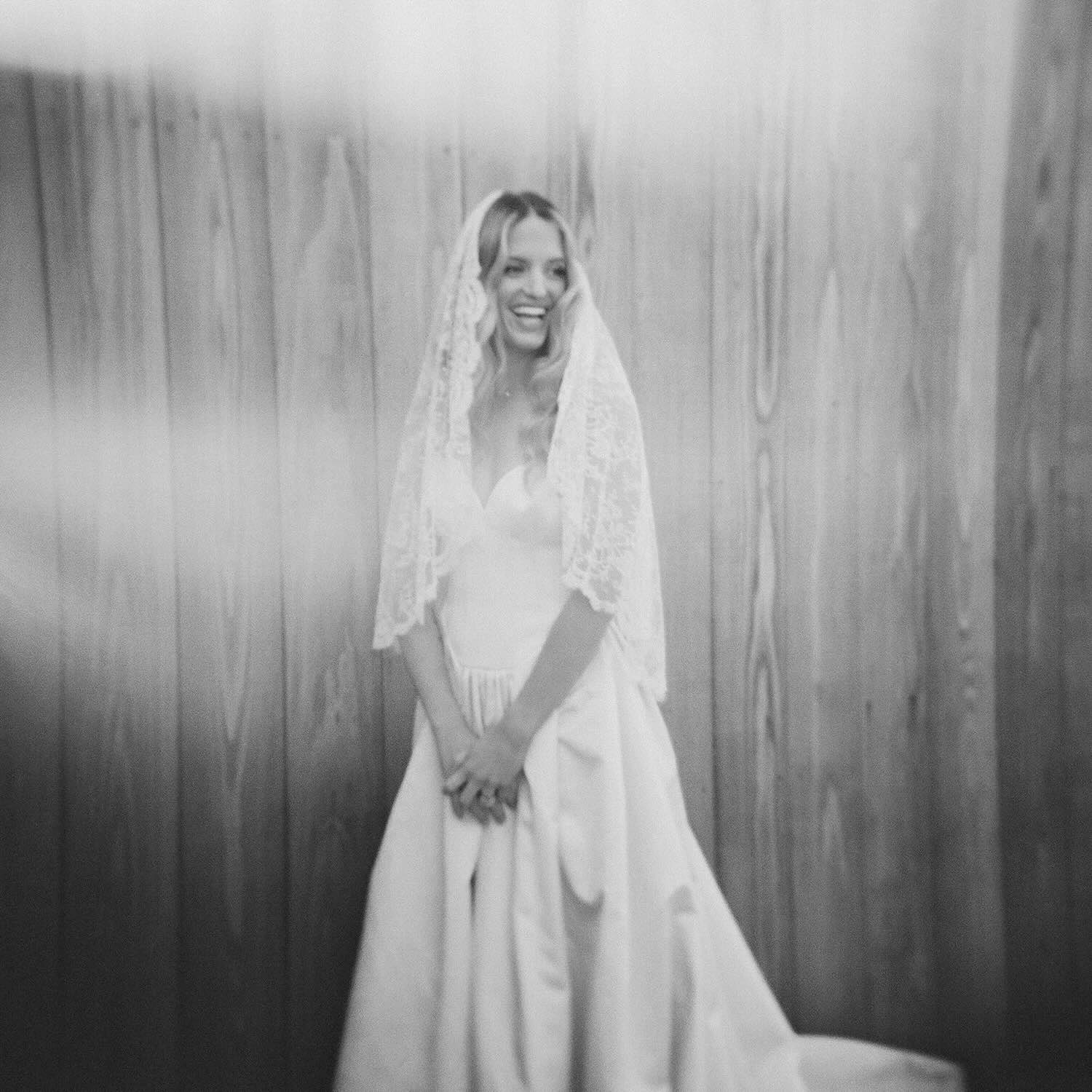 Lihi Hod bridal gown with lace veil styled by Sam Ruiz — Sea Ranch Lodge, California