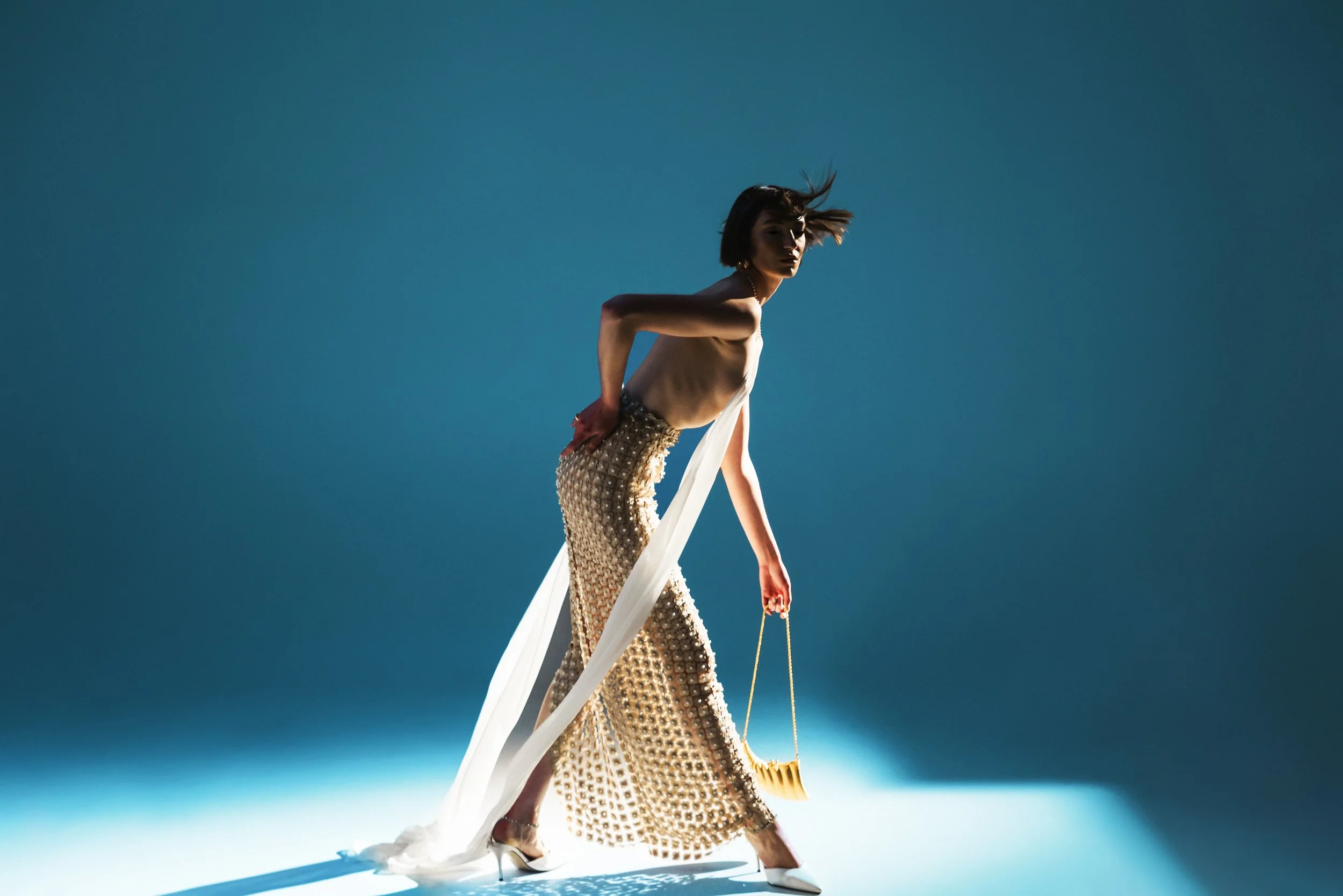 Editorial — Unbound by Convention gold dress